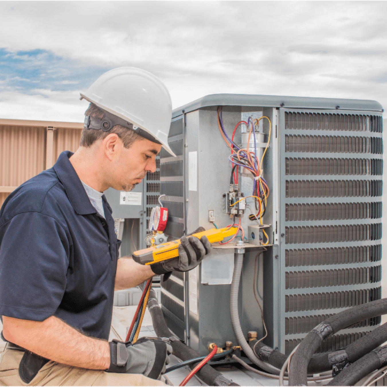 London HVAC Pros technician installing a cold-climate heat pump in London, Ontario