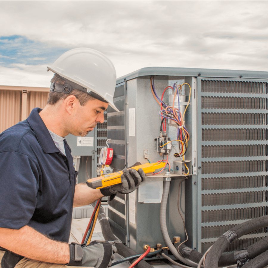 London HVAC Pros technician installing a high-efficiency heating system in a London, Ontario home